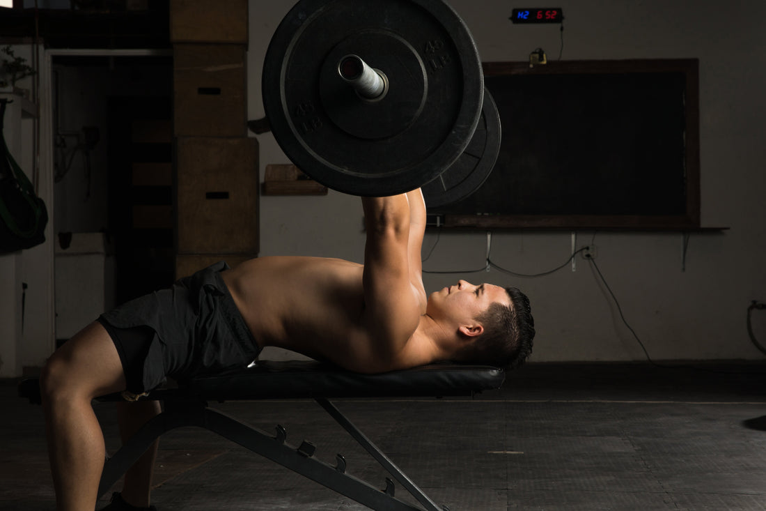 Picture of a person bench pressing in the gym